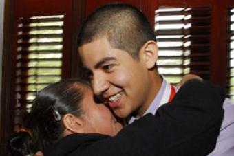 High School Honoree hugs his mother