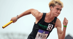 Gavin Matias closeup running a relay race