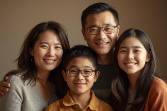 A photorealistic AI image of mother and father and their two kids, boy age 15 and girl age 17..jpg