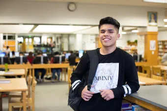 LUCHA student in library