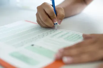 Student with bubble sheet