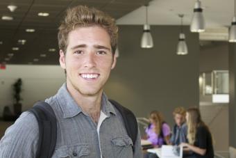 UT High School student stands near his friends in the Student Commons