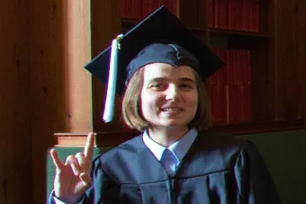 Class of 2015 UT High School graduate gives hook 'em hand sign