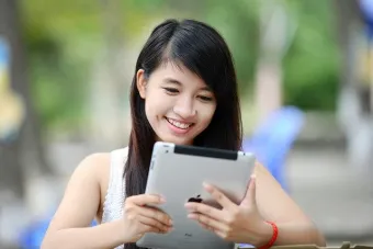 girl with book and computer
