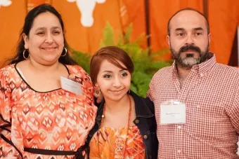 UT High School student and her parents all dress in orange to show school pride